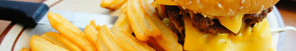 Eating Burger Fast Food Hot Dog at George's Hot Dog Stand restaurant in Fitchburg, MA.